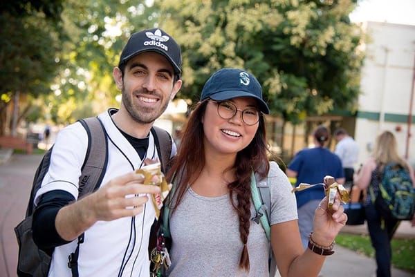 Two students with snacks