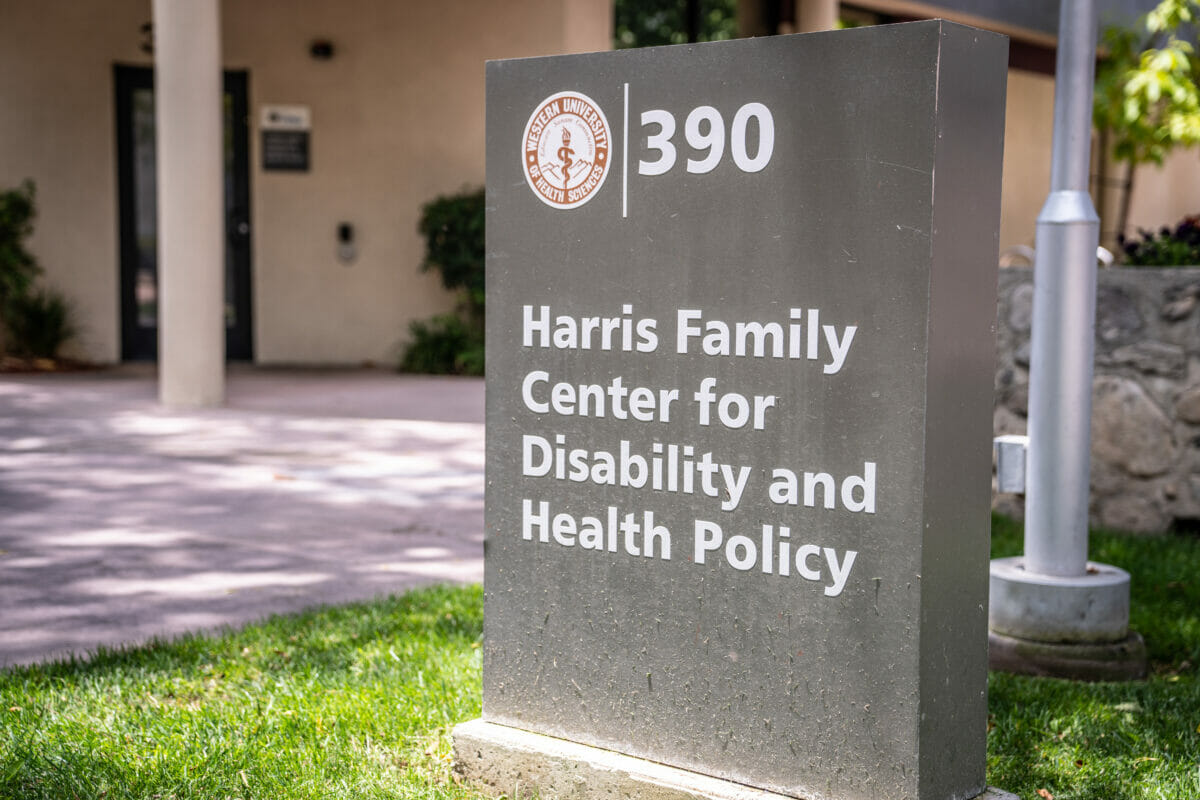 building, disability, health. The Harris Family Center for Disability and Health is identified by a sign on its building.