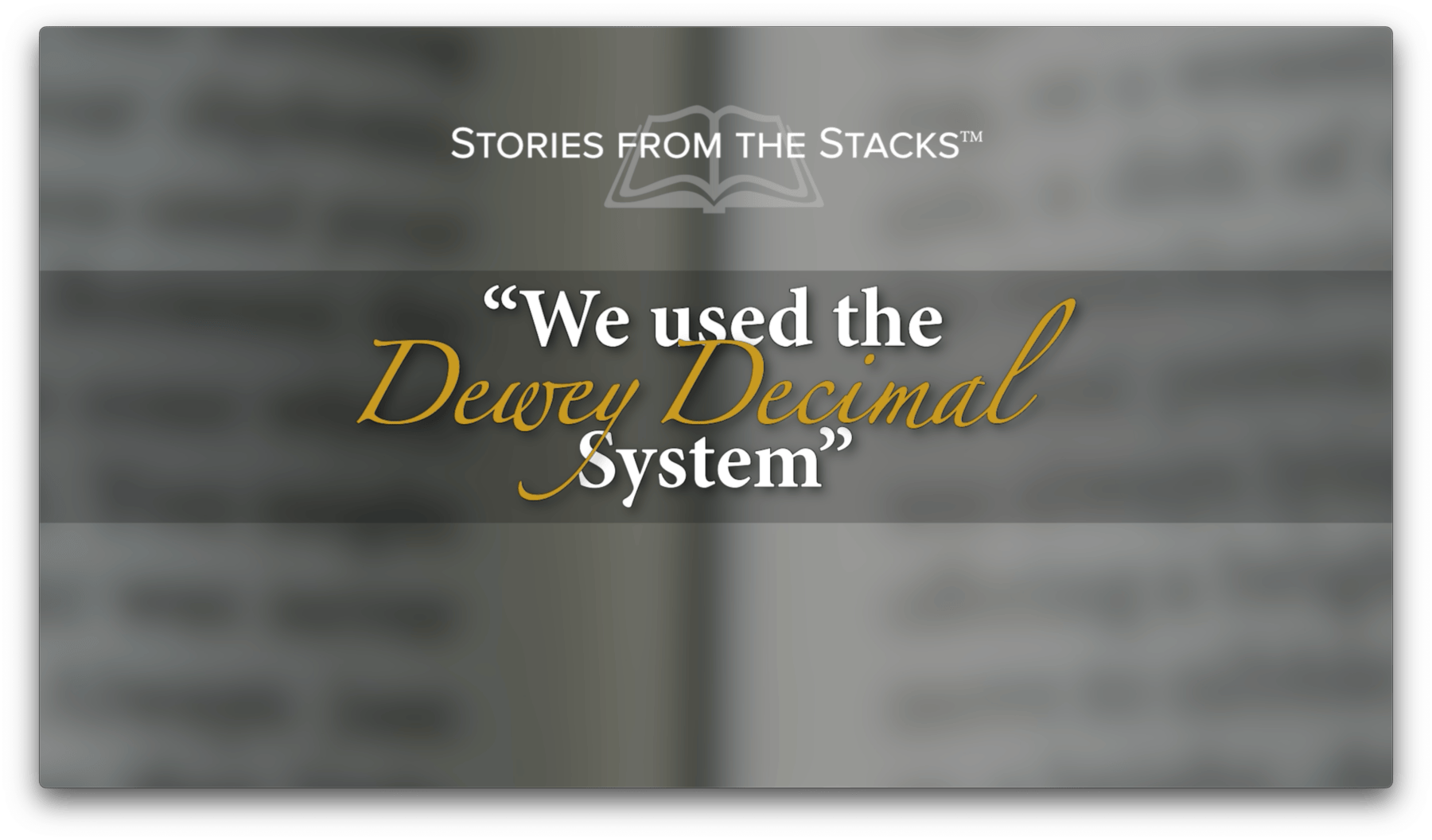 Blurry text on a page with an overlay stating, "We used the Dewey Decimal System" from "Stories from the Stacks.