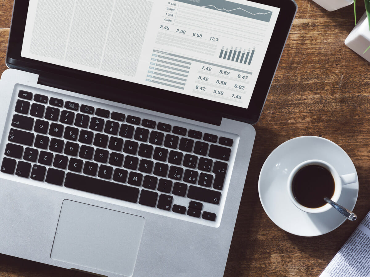 Laptop and coffee cup on desk