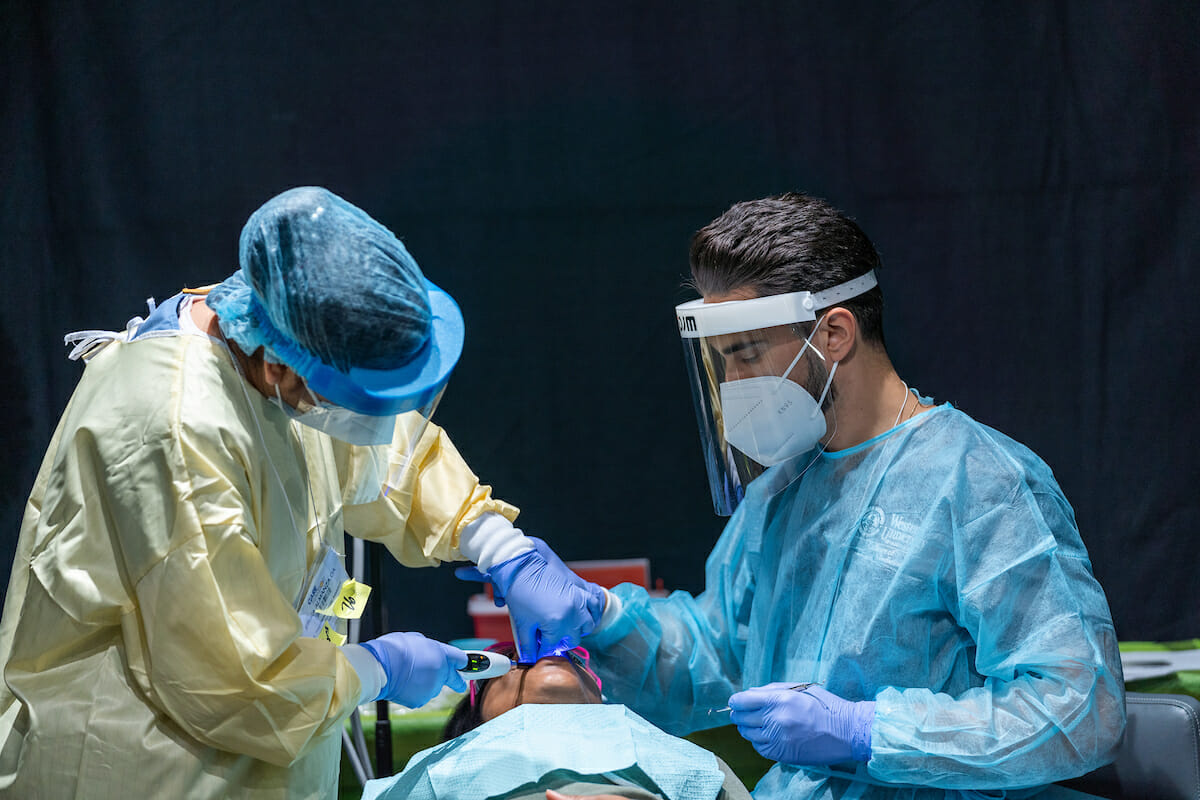 College of Dental Medicine student Javier Tapia. WesternU students, faculty, staff and alumni from the colleges of optometry, dental medicine, podiatric medicine and osteopathic medicine provided free care to those in need during the first day of the Care Harbor mega clinic at The Reef in downtown Los Angeles Friday, March 4, 2022. WesternU volunteers are serving at Care Harbor through the weekend.