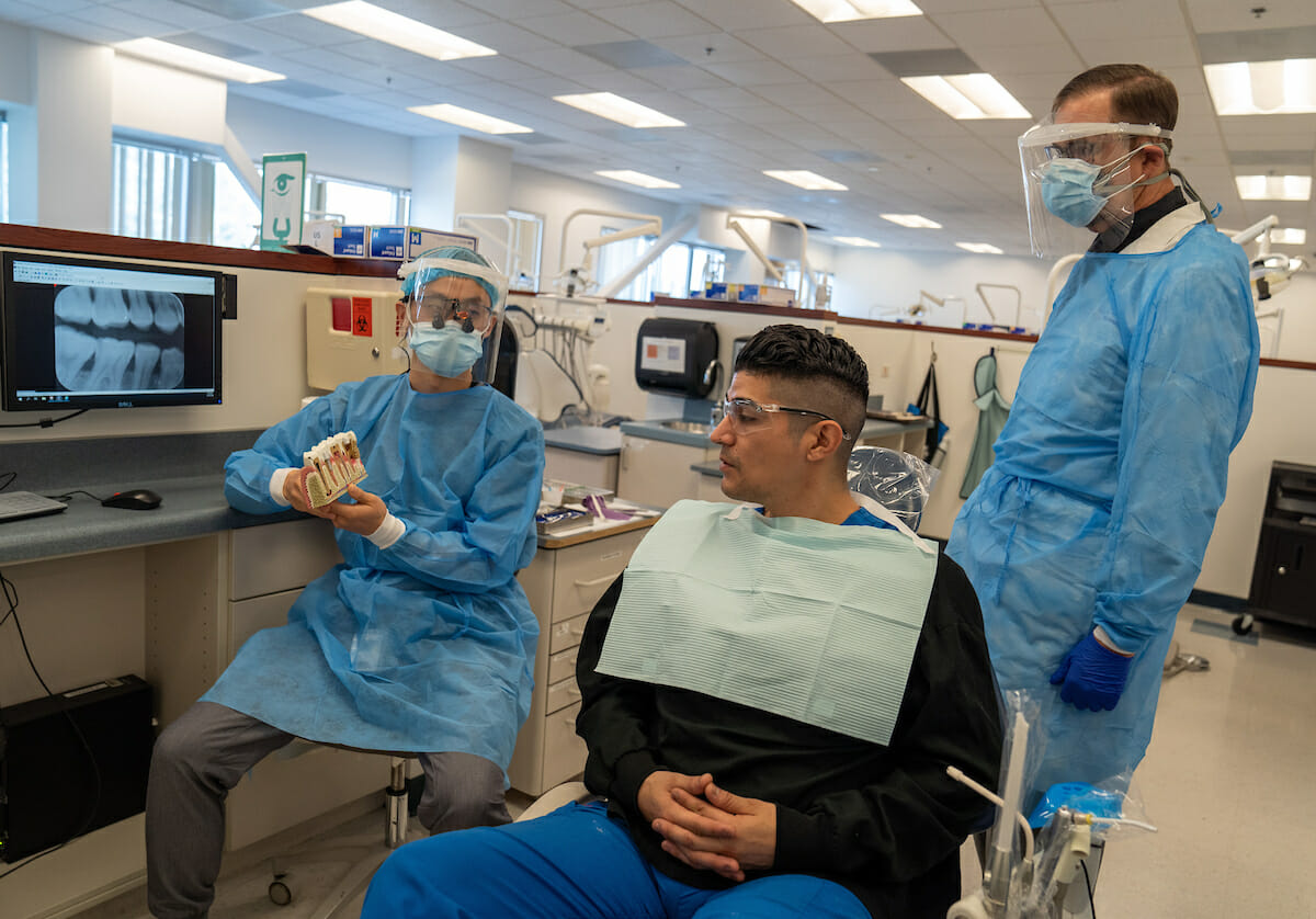 CDM Assistant Professor Grant Burdick, DDS, with fourth-year student