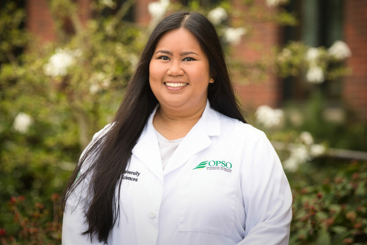 woman, lab coat, long hair.