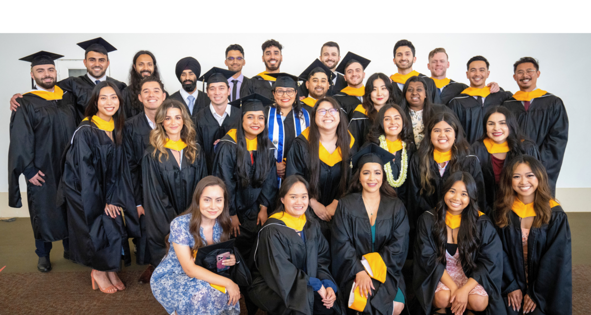 A group of graduates posing for a photo.