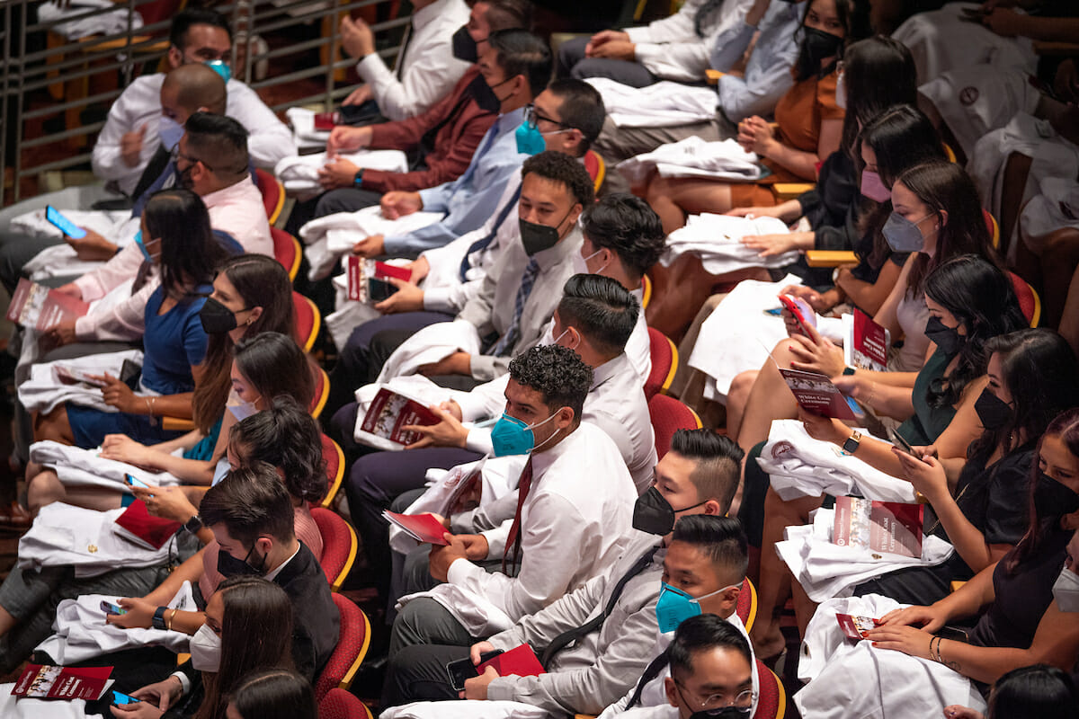 a group of students sitting next to each other.