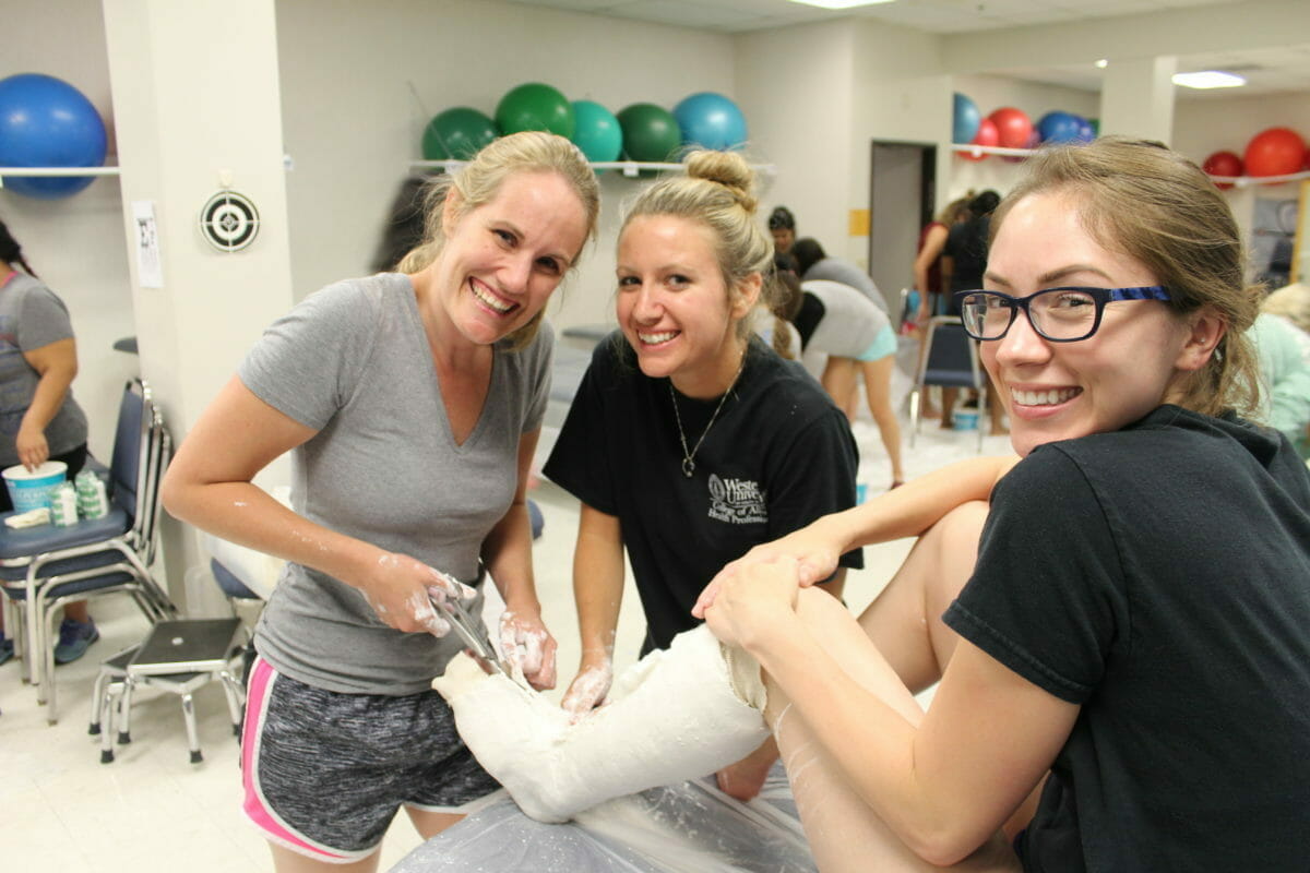 three DPT student are studying casts