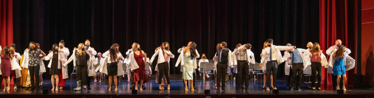 A group of people standing on a stage.