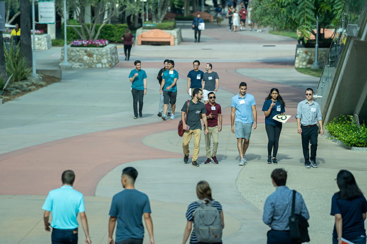 sidewalk, people.Incoming students from the College of Osteopathic Medicine of the Pacific and the College of Podiatric Medicine collaborated in a Pomona campus scavenger hunt during WesternU Welcome Week