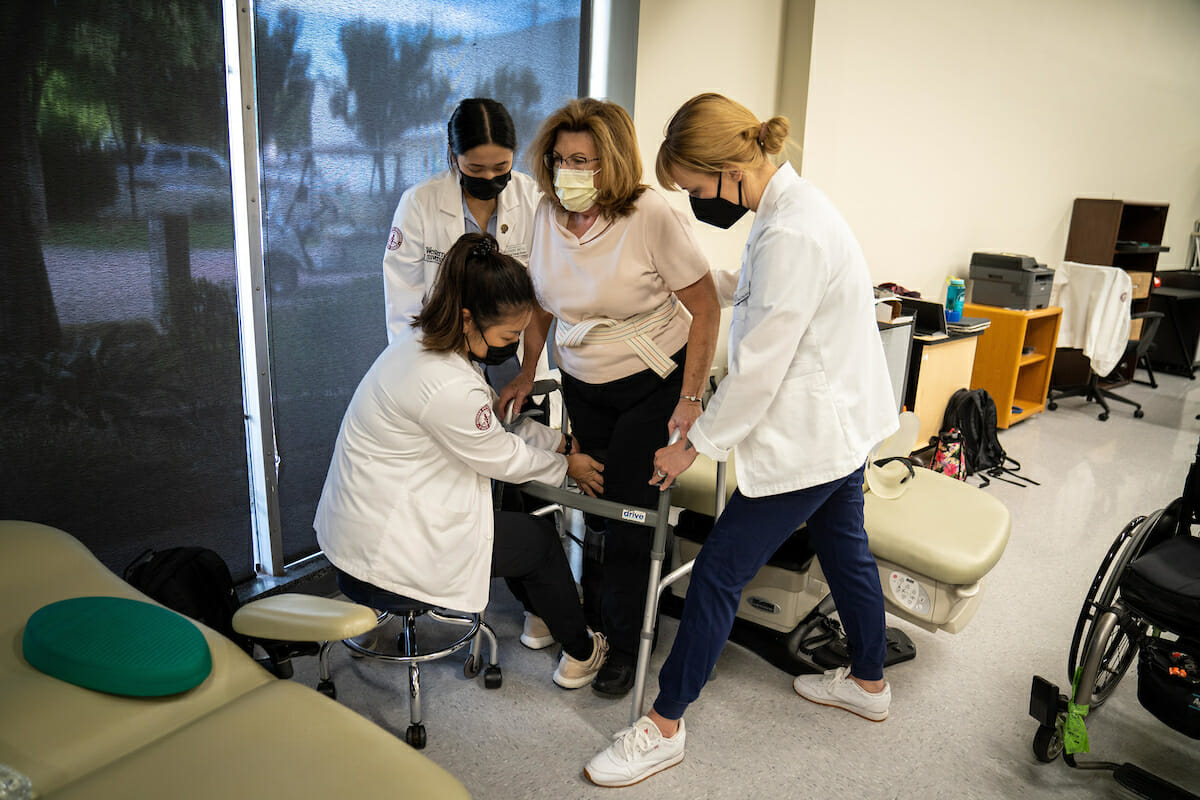 medical professionals, patient's leg