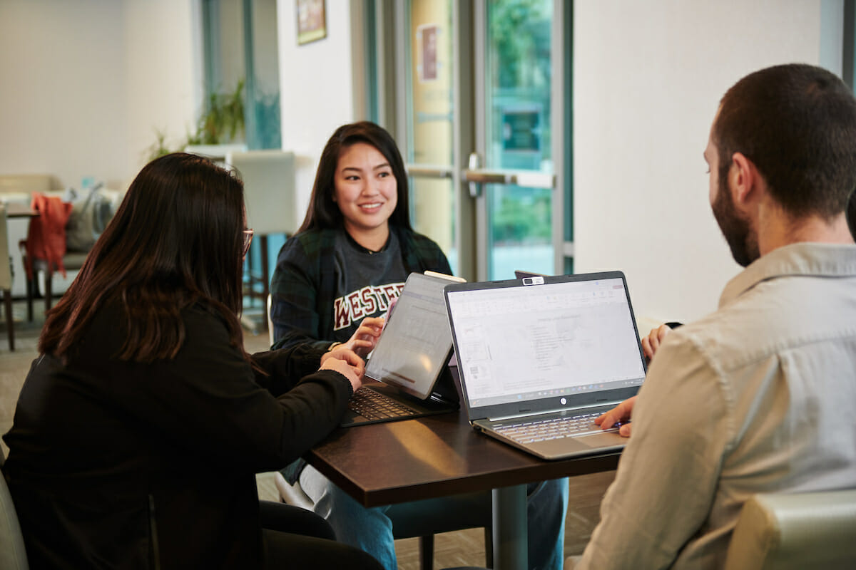 WesternU student studying and talking