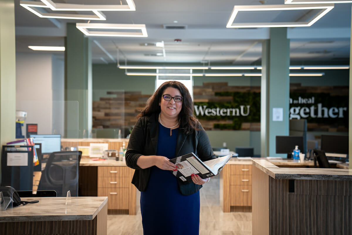 Pumerantz Director Karoline G. Almanzar, MLIS in the lobby.