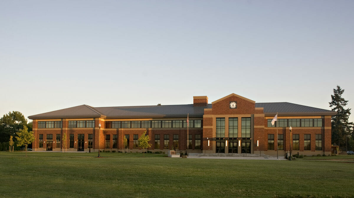 brick building, grassy field