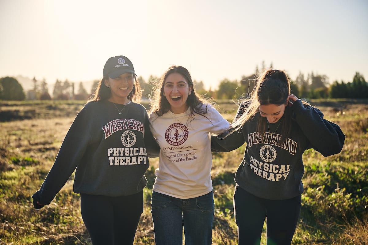 Three females smiling