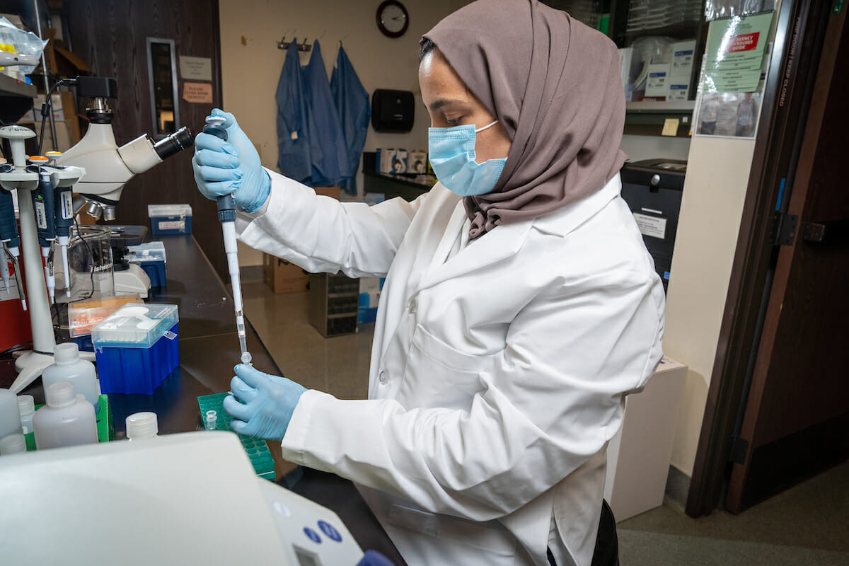 woman, lab coat