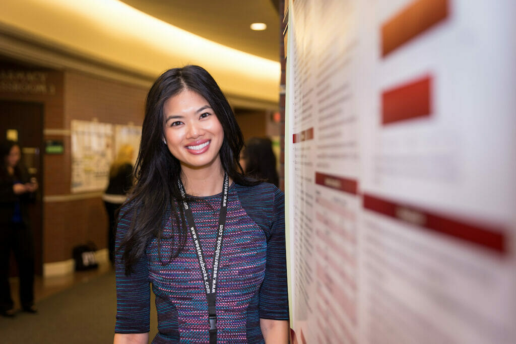 Female student, standing in hall