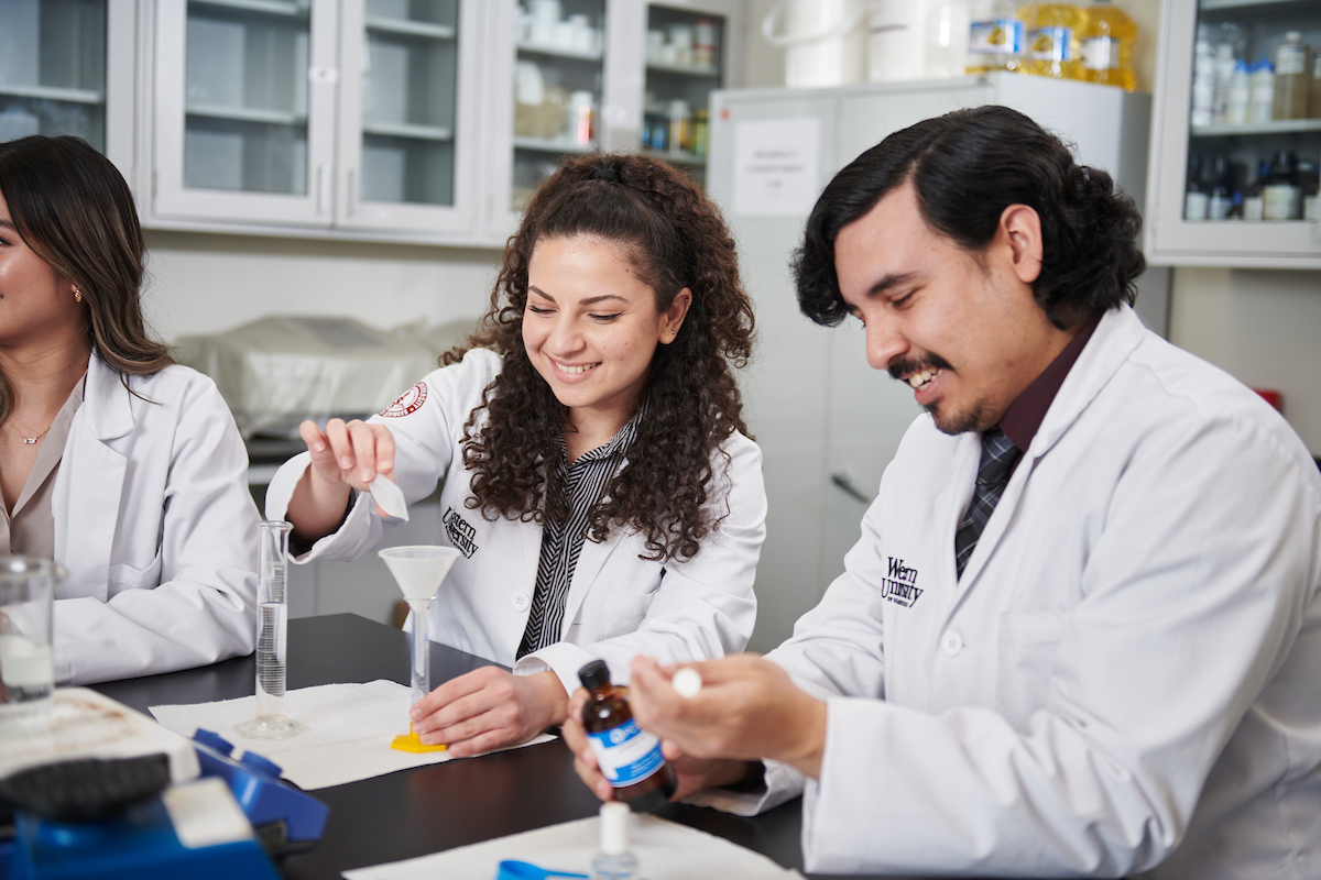 WesternU College of Pharamcy student pharmacists simulating experience in the compounding lab and ressearch