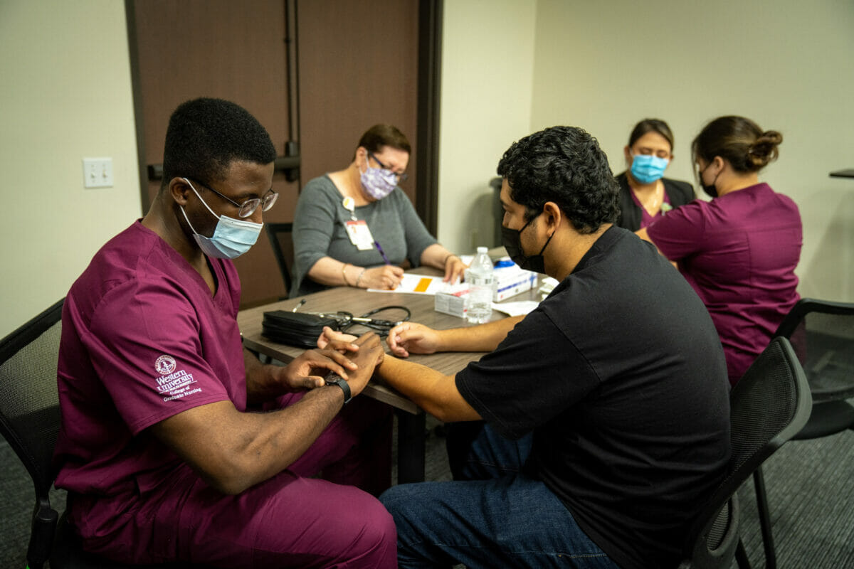 Male student nurse in skills lab.