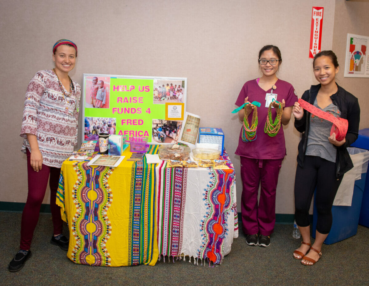 Three students in CGN Student Clubs, booth for Funds for Fred Africa