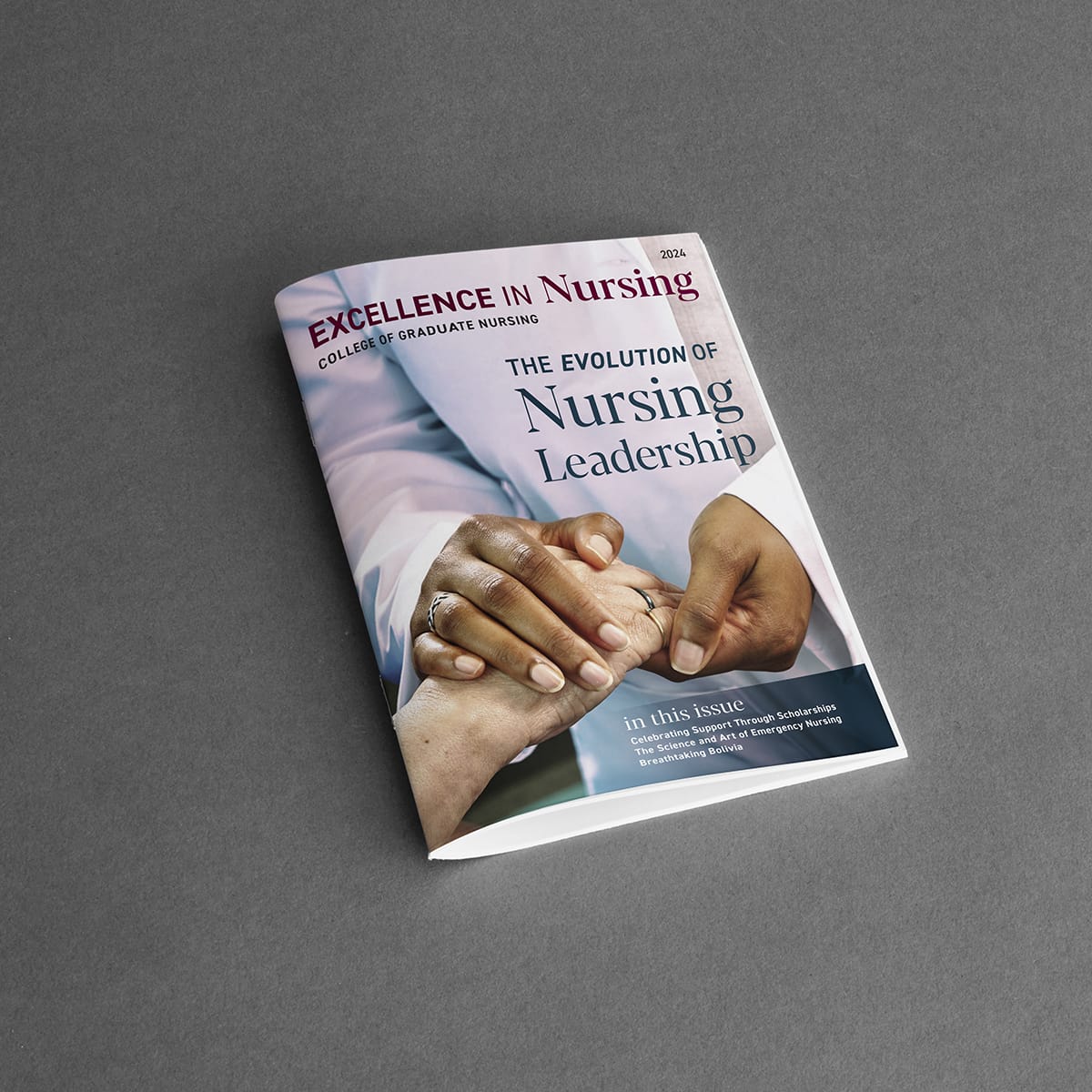 A magazine titled "Excellence in Nursing" with the main headline "The Evolution of Nursing Leadership" and an image of two hands holding each other on the cover.