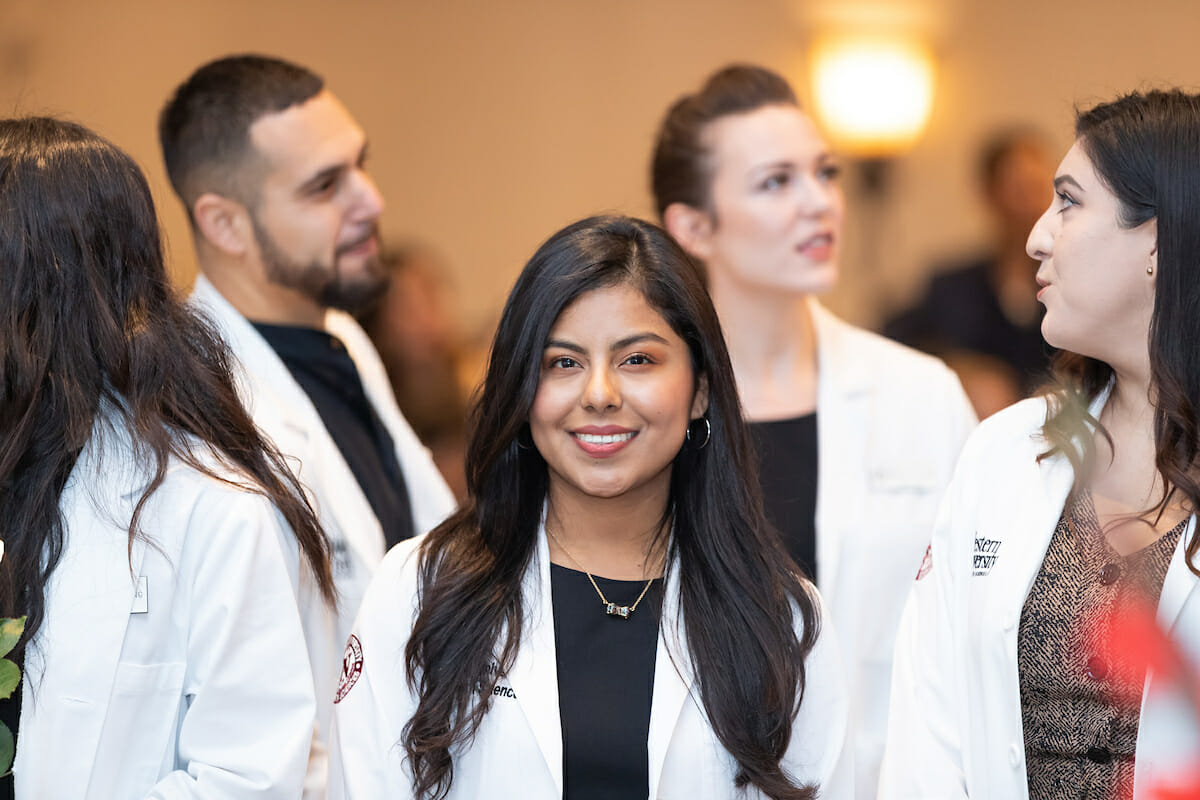 CGN student is smiling at CGN MSNE Pinning Ceremony