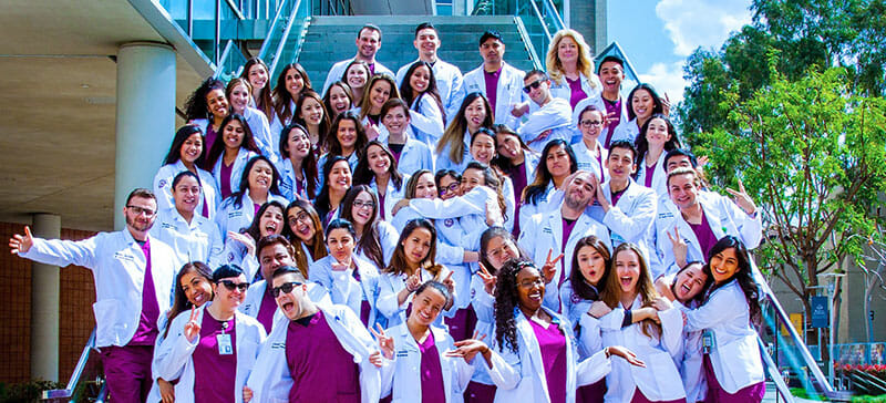 Nursing students outside on HEC staircase