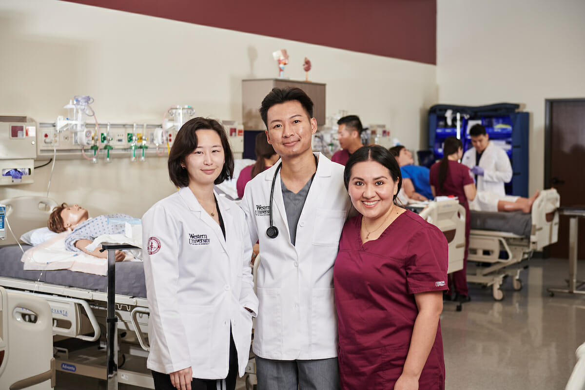 a group of nursing students standing next to each other.