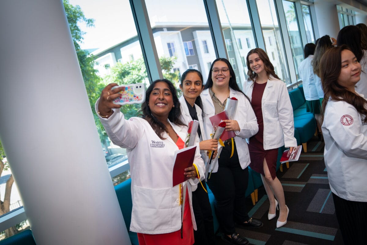 Optometry students during welcome week white coat