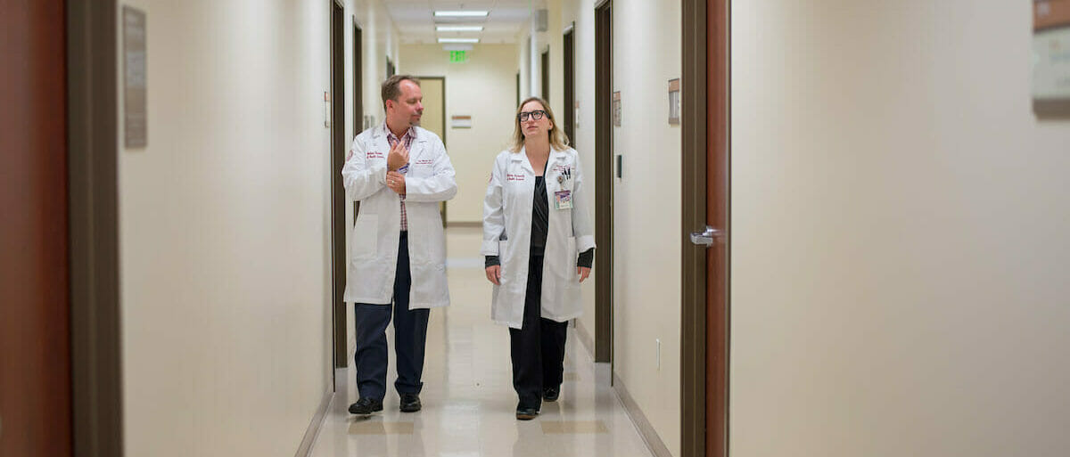 Executive Director for Patient Care Centers and Chief of Clinical Integration Rob Warren, DO '01, and Chief Medical Officer for the Medical Centers Stephanie White, DO '01.