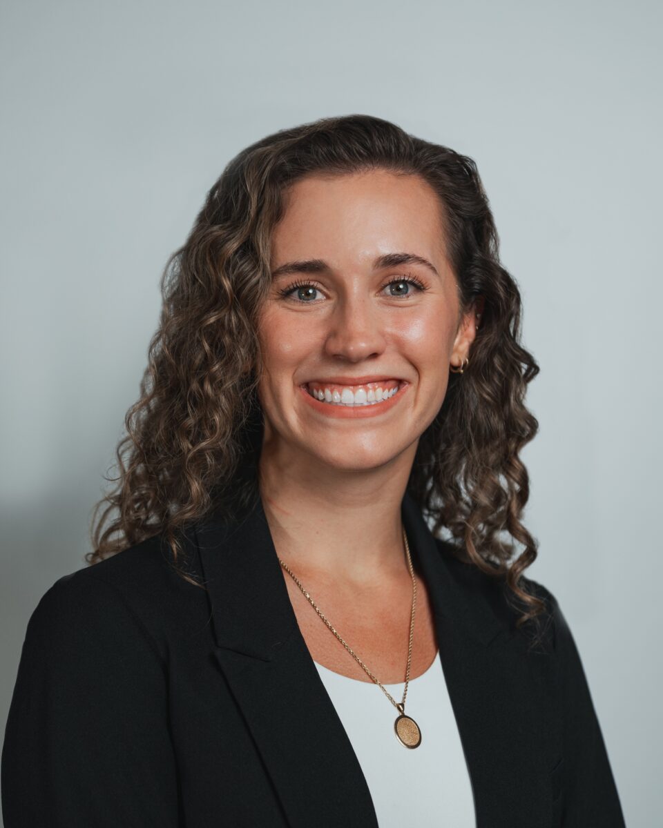 A woman smiling for a picture.