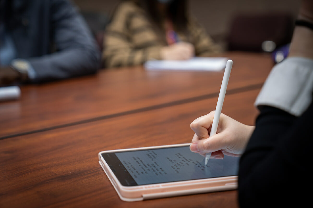 College of Pharmacy Student Taking Notes in Class