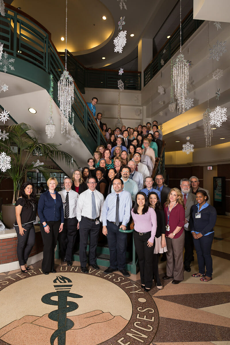 Group photo of faculty and staff on staircase