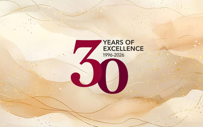 Beige and gold abstract background with the text "30 Years of Excellence 1996-2026" in the center.