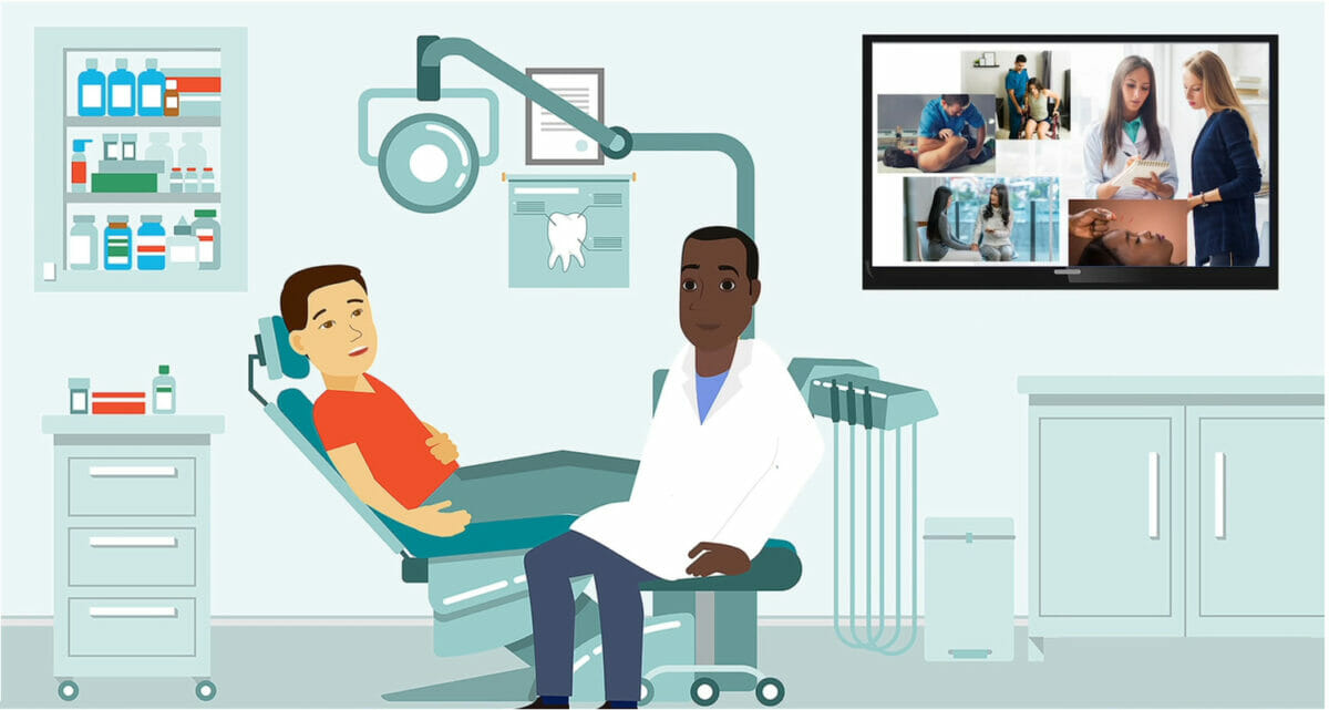 Image of a patient in the dentist chair and the dentist sitting next to him