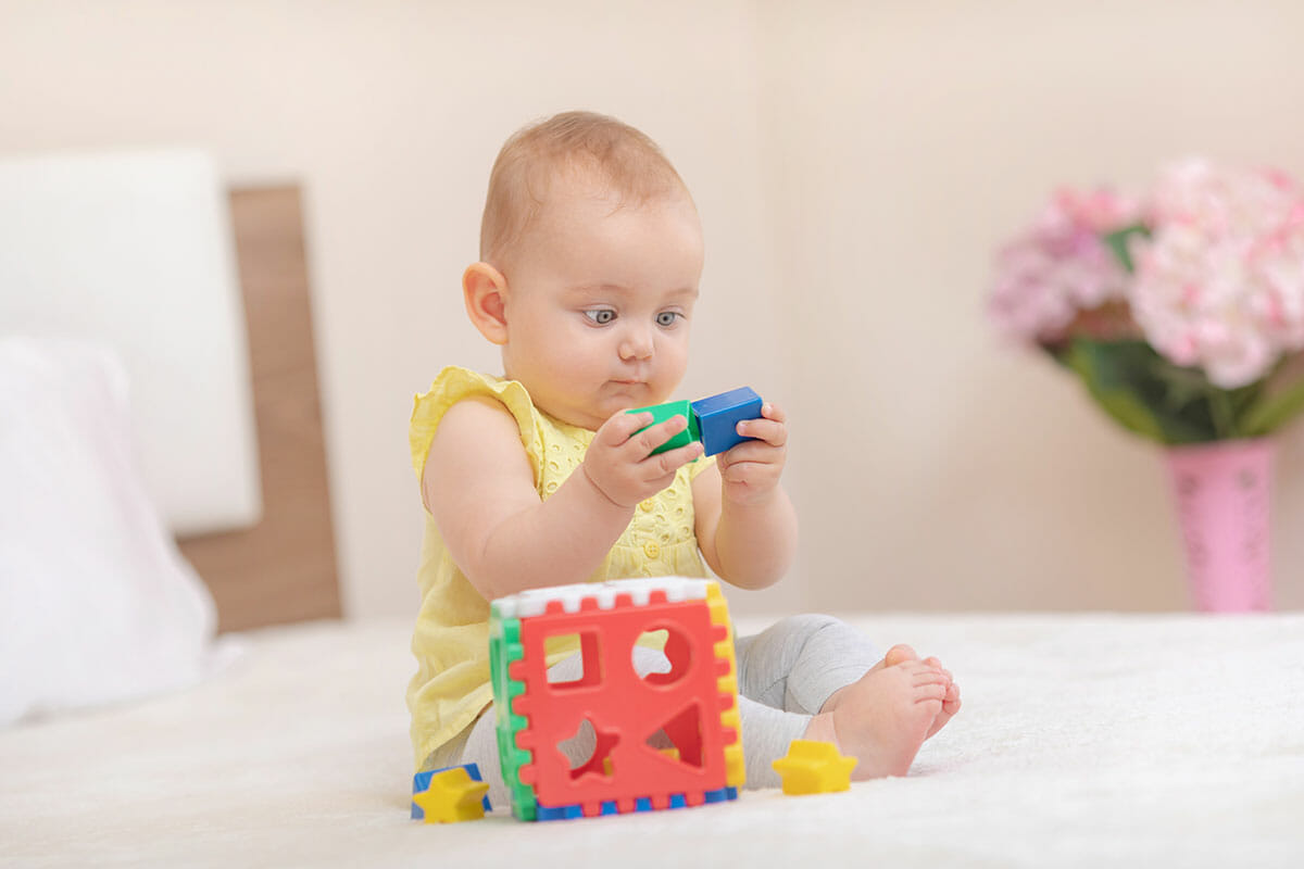 baby playing blocks