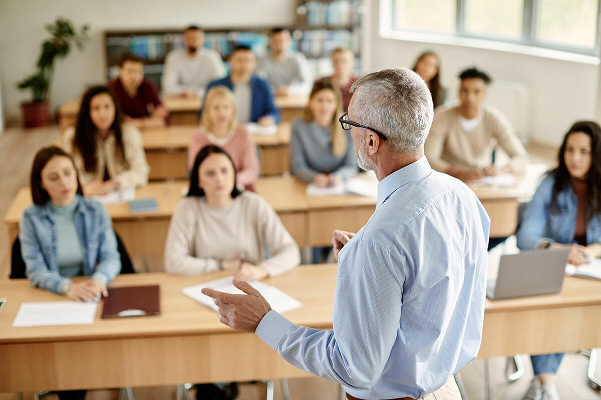 back view of professor lecturing to students