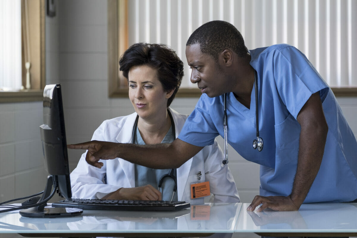 Image of 2 Doctor of Nurse Practitioners in a meeting