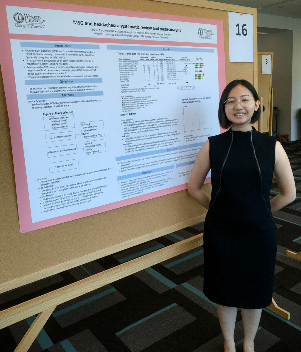 Student Tiffanie Tran standing near research poster