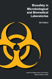 Cover of "Biosafety in Microbiological and Biomedical Laboratories, 6th Edition" featuring a large yellow biohazard symbol on a black background.