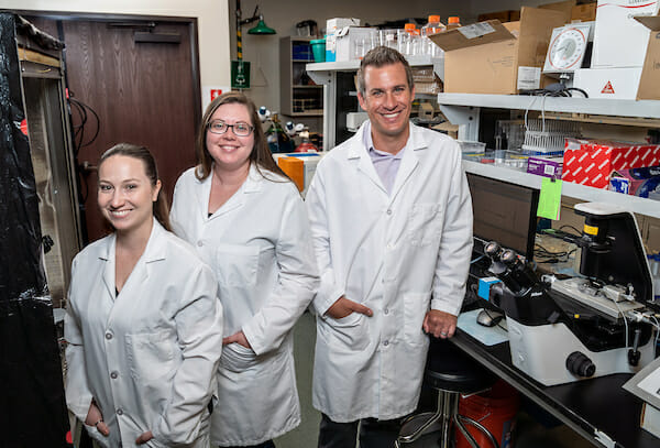 College of Pharmacy Assistant Professor Simon Bulley, PhD, was awarded a four-year grant from the American Heart Association to study Autosomal Dominant Polycystic Kidney Disease. Bulley, right, in the lab with second-year MSPS student Angela Reinert, left and Hailey Daker, MSPS ’19.