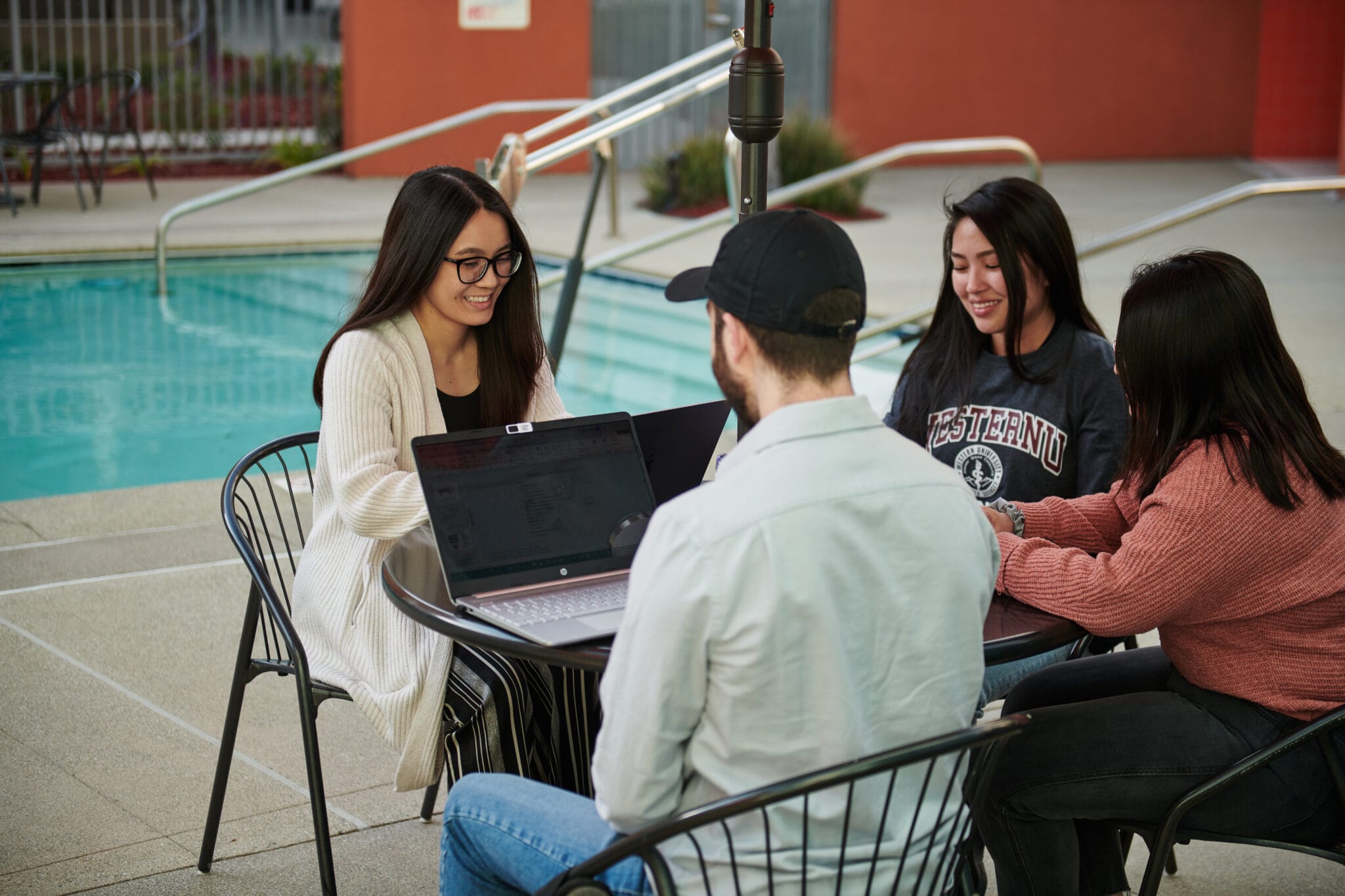 university students studying and having conversation