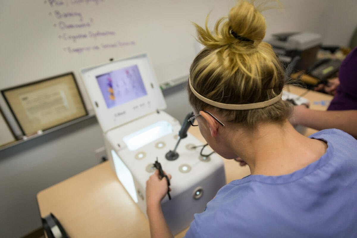 VetMed student learning laprascopic techniques during training