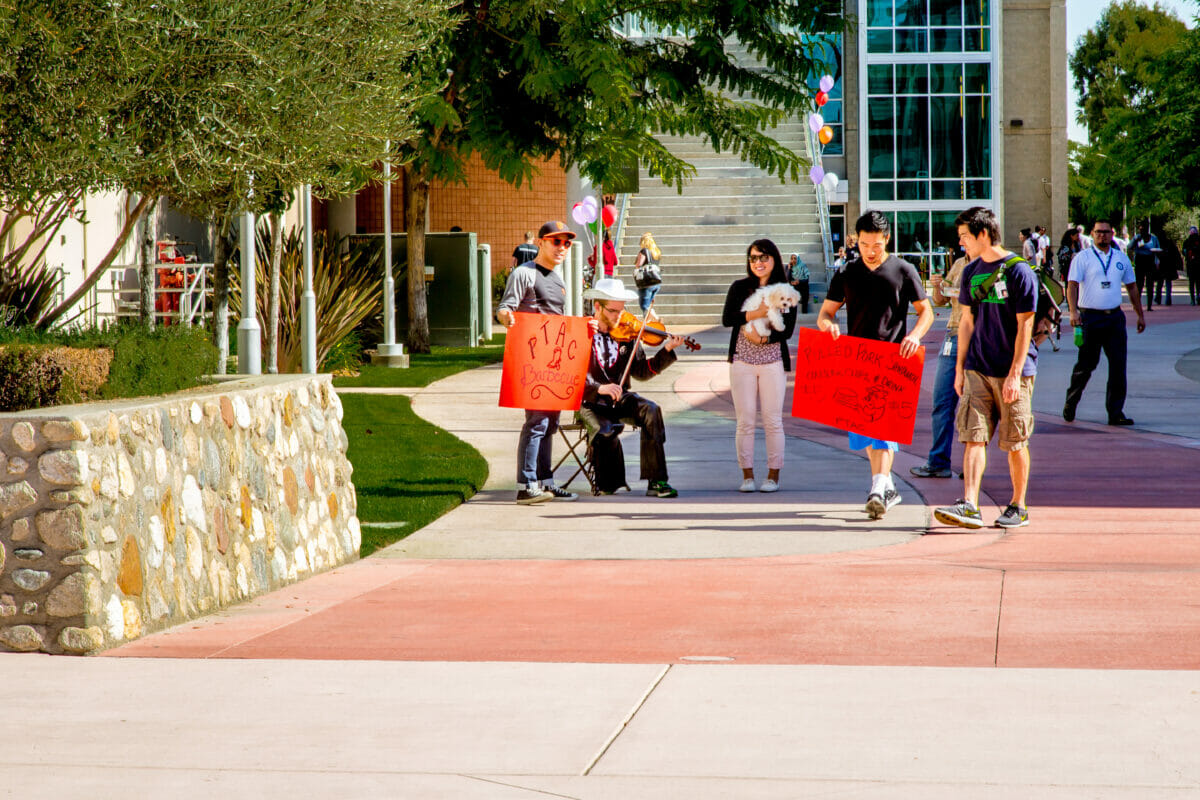 Students advertise barbecue event on the esplanade