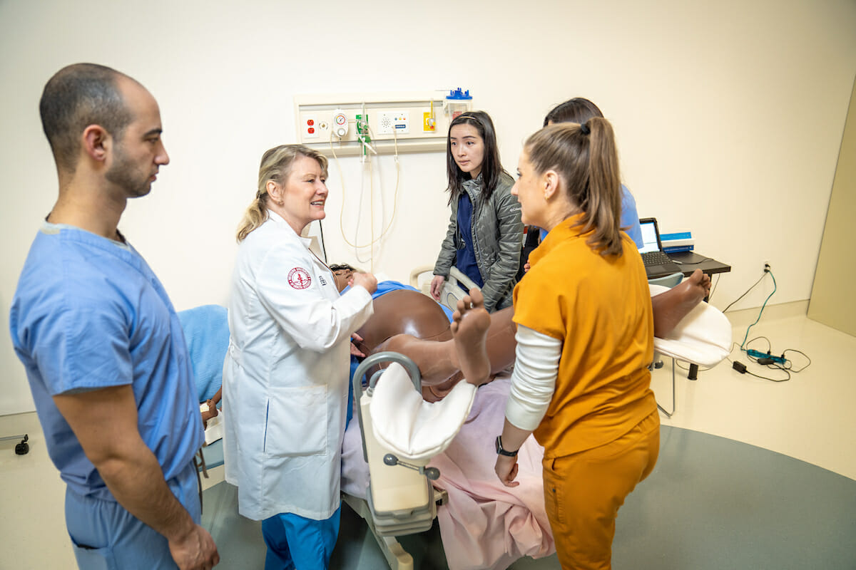 Students working with Victoria patient simulator