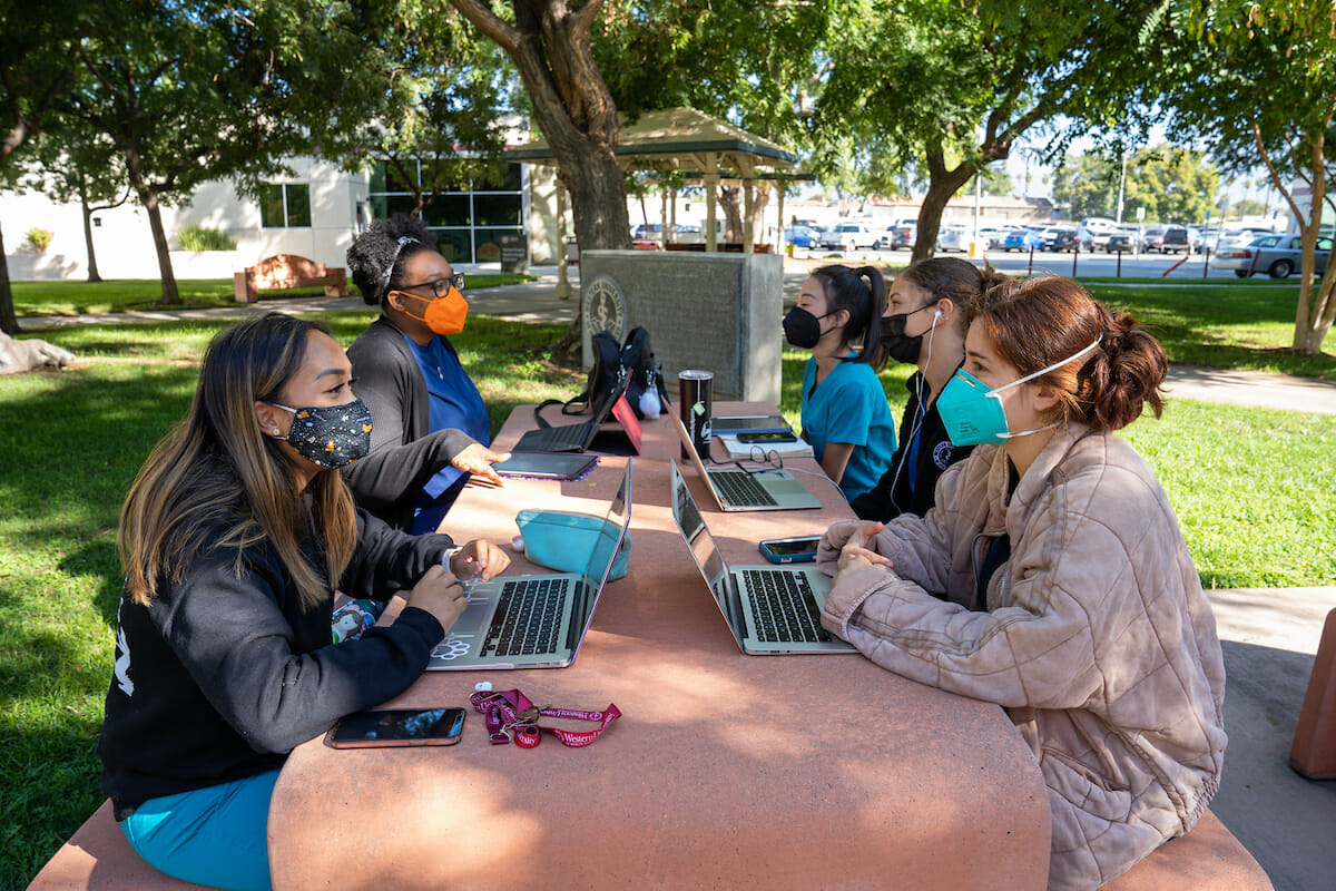 irst-year CVM students studnt on the WesternU campus at Ethan Allen Park. From left are Katrina Billote, Angelica Touze, Kelly Pham