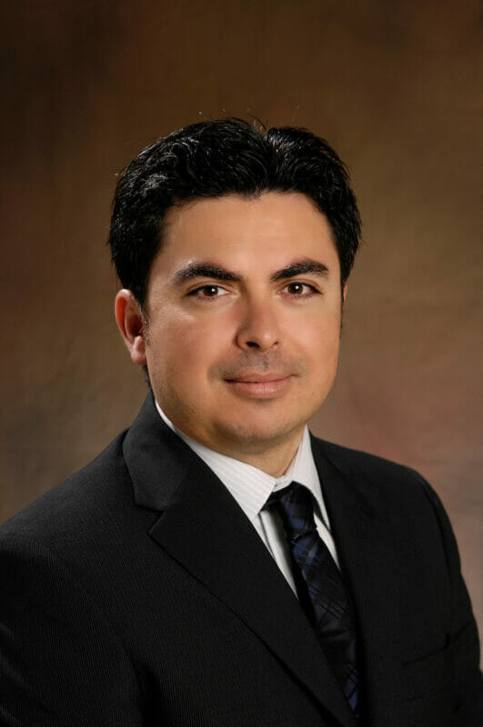 Efrain Castellanos, OD, MS, PhD, FCOVD Portrait of Efrain Castellanos, OD, MS, PhD, FCOVD