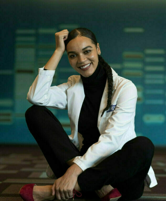 student sitting with smile