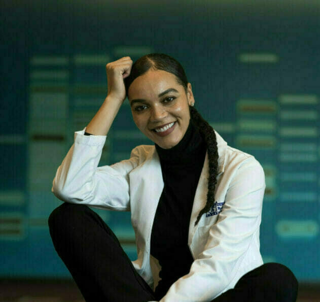 student sitting with smile