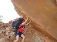 a picture of a man rock climbing