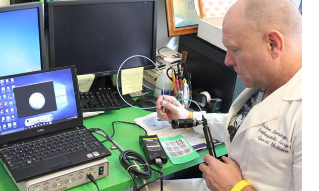 Dr. Brion Benninger doing reasearch in his lab