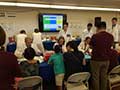 the 13th Annual Asian Community Health Fair pixruew of thirty-two COMP-Northwest students assisting in health screenings